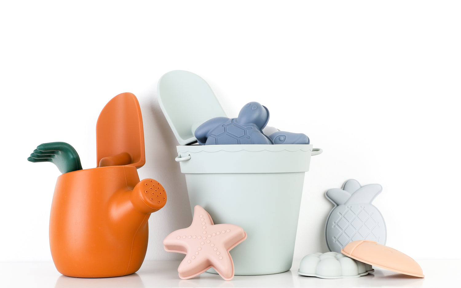 Silicone Garden Toys and Beach Toys Displayed on a white shelf