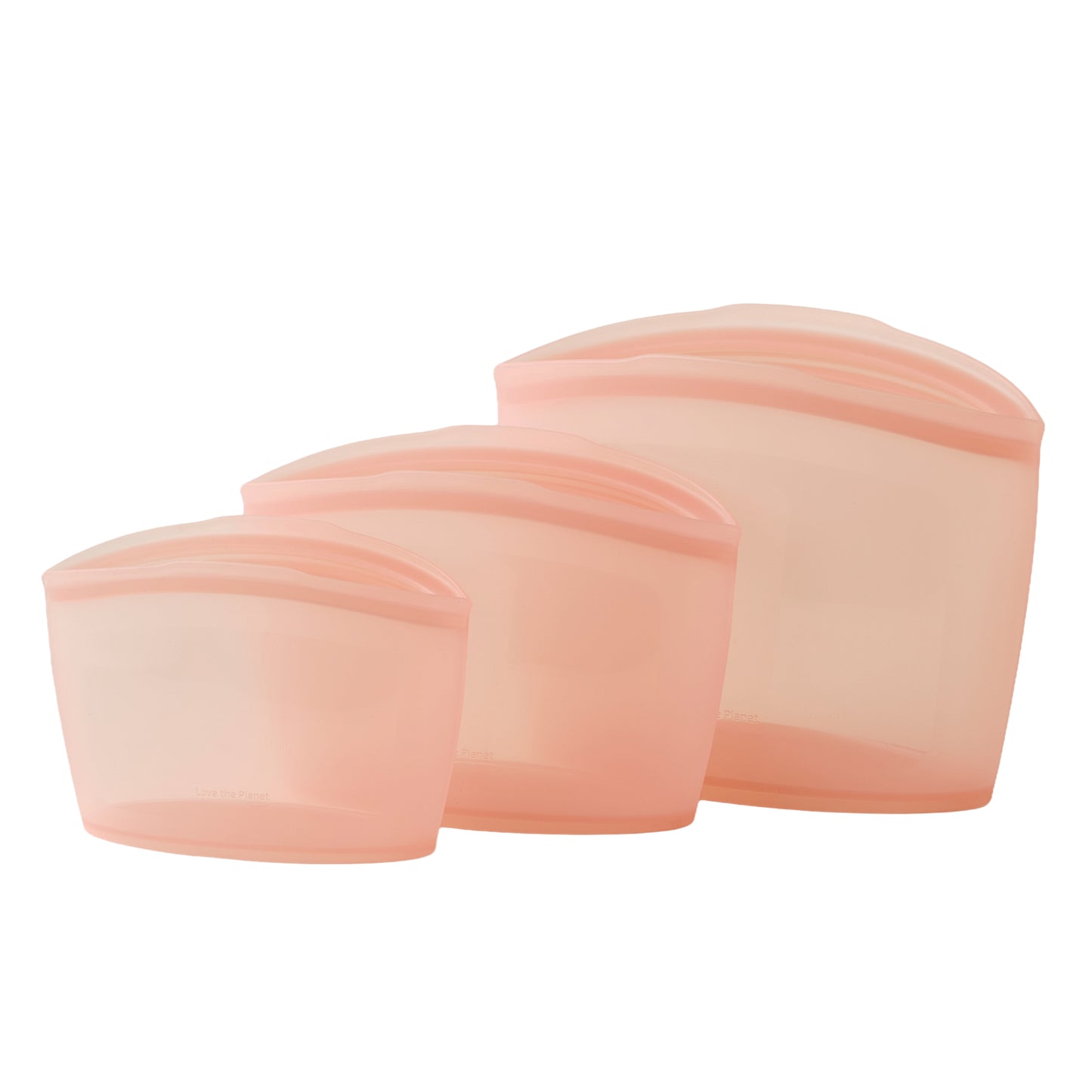 Set of three peach-colored silicone bags on a white background