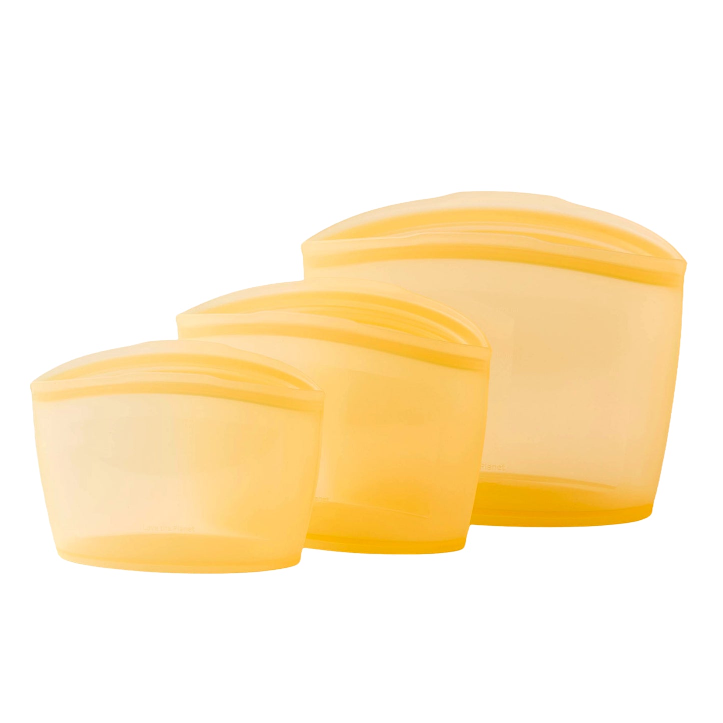 Set of three pumpkin yellow silicone food storage containers on a white background