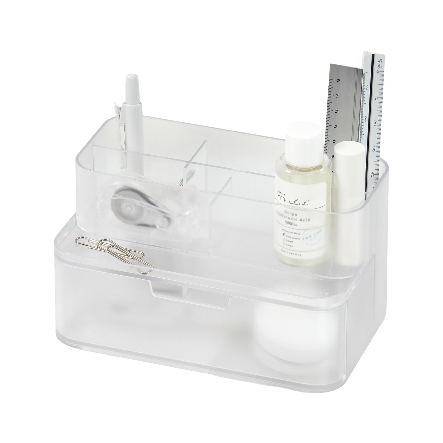 Transparent compact desk organizer with stationery items on a white background.