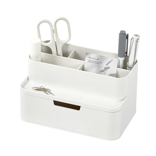 White desk organizer with compartments holding office supplies on a white background