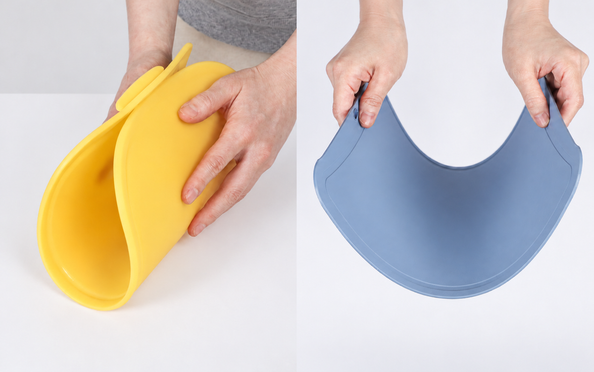 Side-by-side photos of hands bending yellow and blue Blue Ginkgo cutting boards to show their flexibility.
