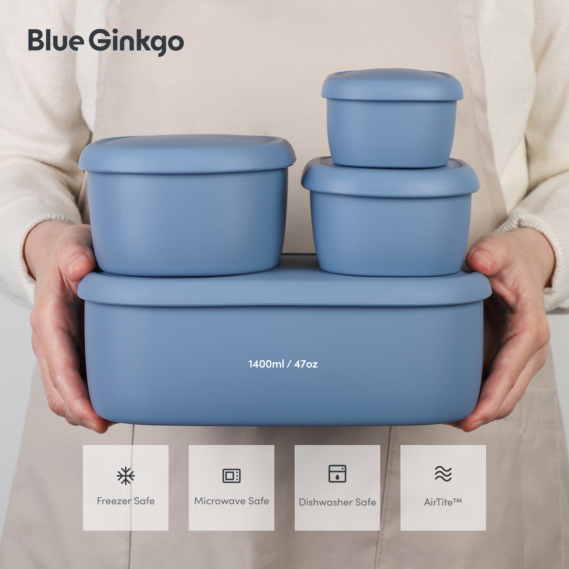 Set of blue silicone food containers held by a person