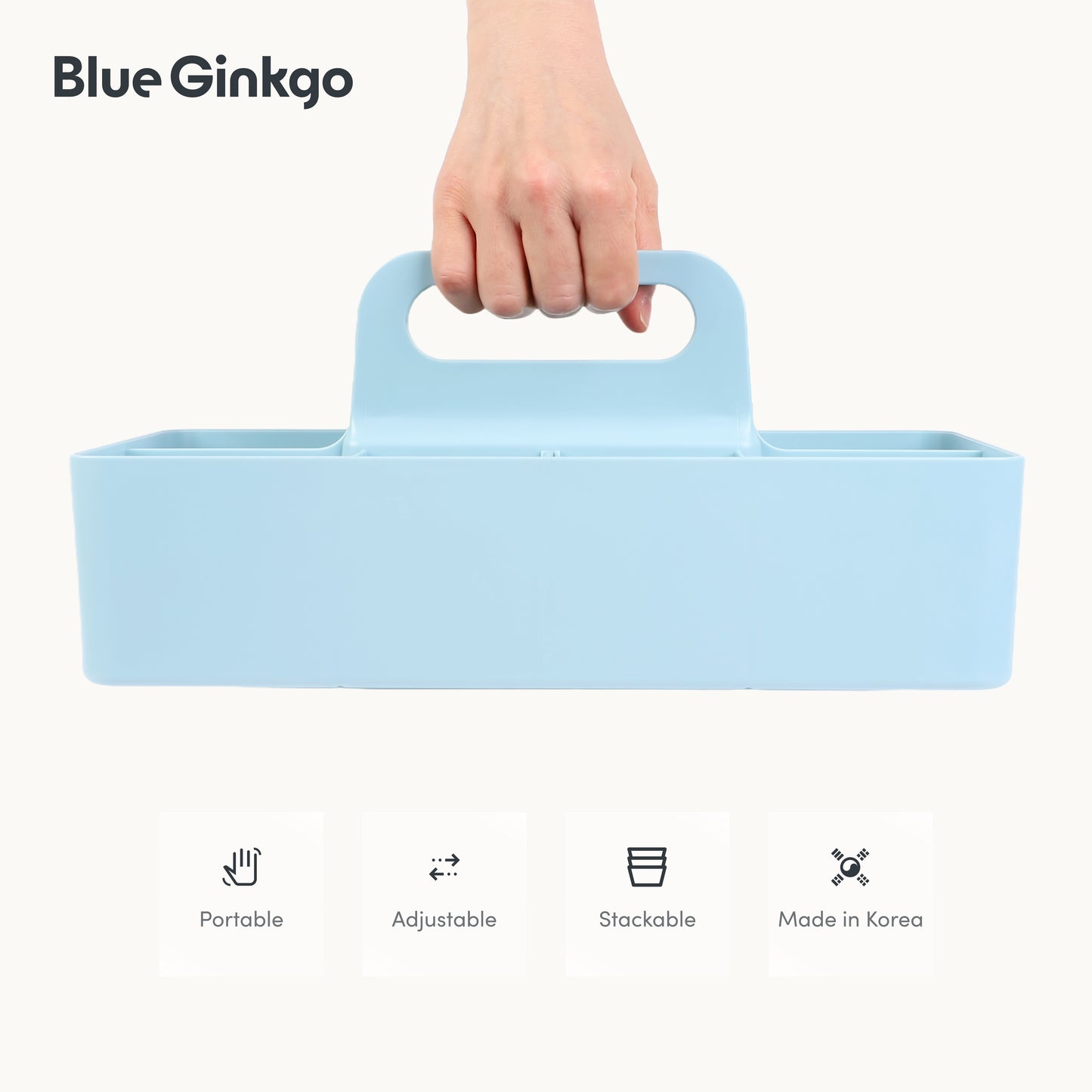 Light blue long rectangle caddy held by a hand.