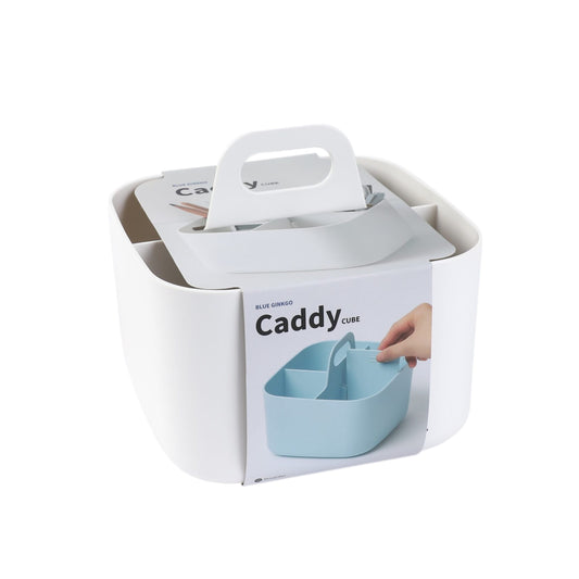 A white square storage caddy with a handle on top against a white background